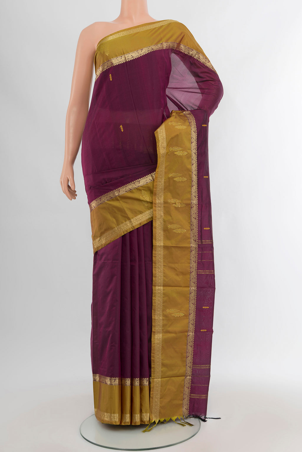 Purple Kanjivaram Silk Saree with Zari Butta on the body and Zari Border.  displayed on a mannequin