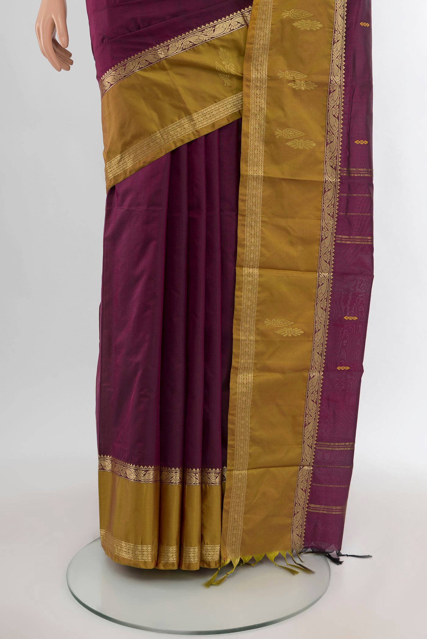 Pleats and pallu of Purple Kanjivaram Silk Saree with Zari Butta on the body and Zari Border. 