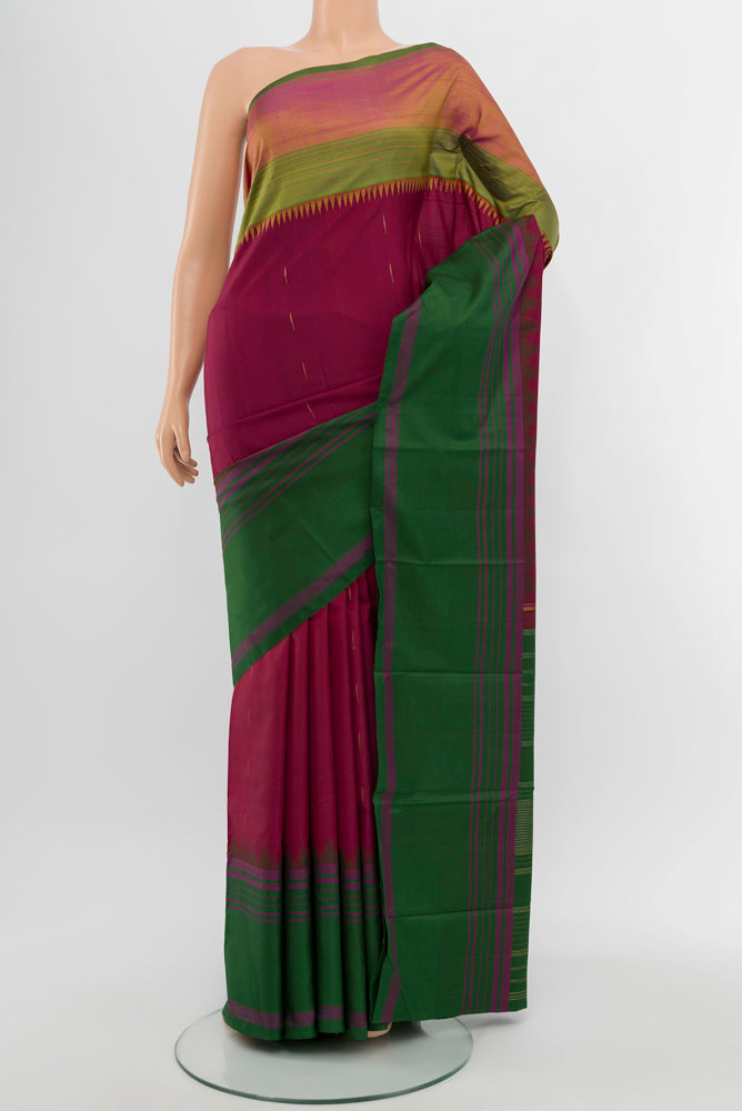 Multi Color Kanjivaram Silk Saree with Plain Body and Silk Border.  displayed on a mannequin
