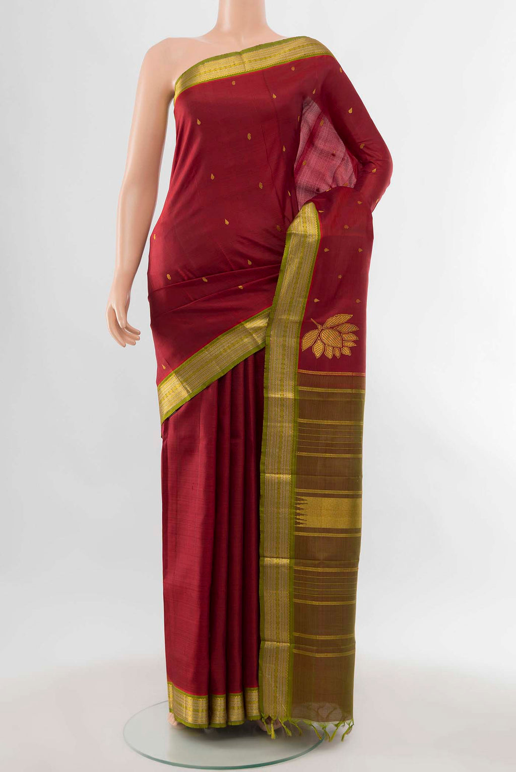 Pure Silk Pure Zari Maroon Kanchipuram Saree with Zari Butta on the body and Zari Border displayed on a mannequin
