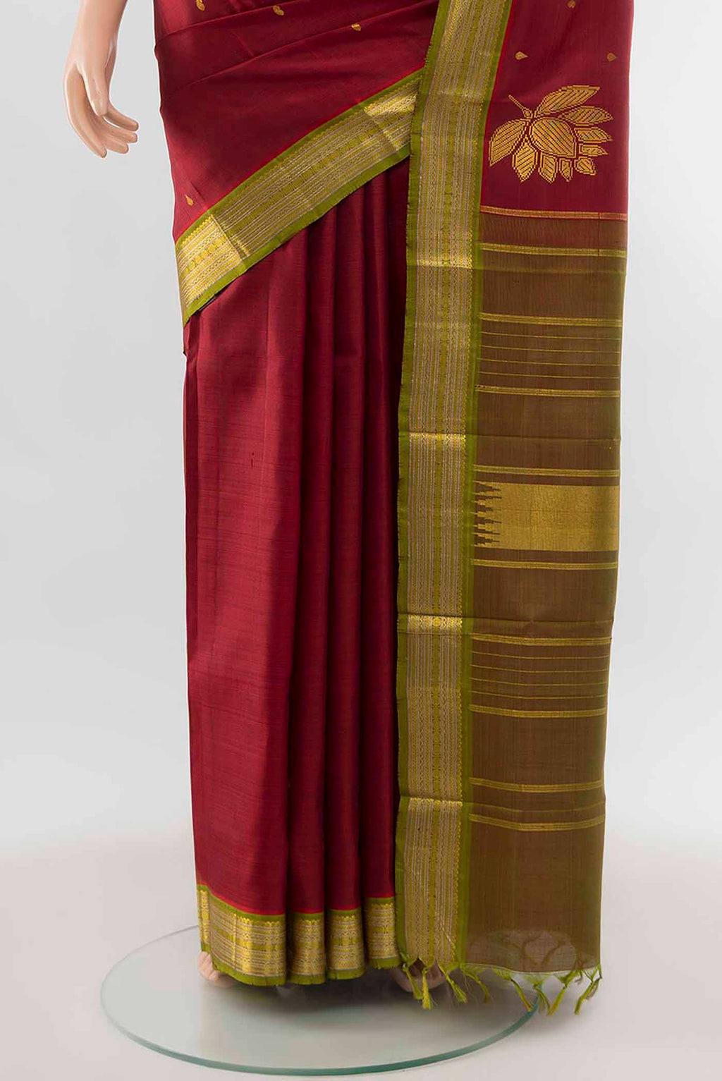 Pleats and pallu of Pure Silk Pure Zari Maroon Kanchipuram Saree with Zari Butta on the body and Zari Border