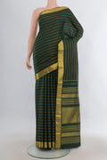 Pure Silk Bottle Green Kanjivaram Saree with Stripes on the body and Zari Border.  displayed on a mannequin