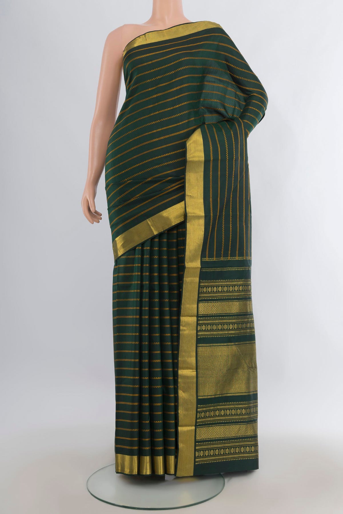 Pure Silk Bottle Green Kanjivaram Saree with Stripes on the body and Zari Border.  displayed on a mannequin