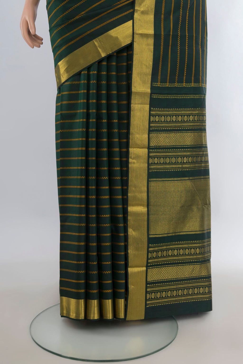 Pleats and pallu of Pure Silk Bottle Green Kanjivaram Saree with Stripes on the body and Zari Border. 