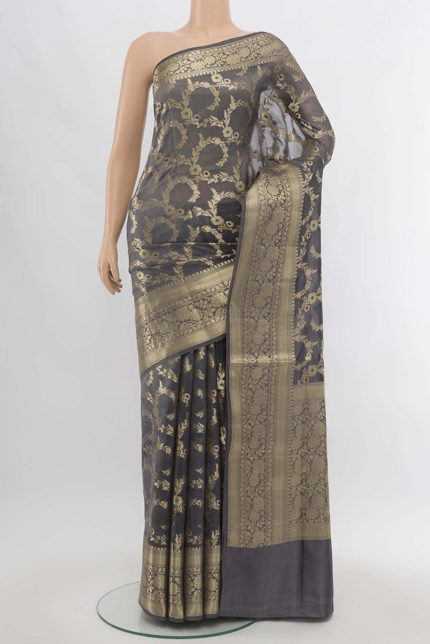 Grey Banarasi Raw Silk Saree with Zari Butta on the body and Silk Border.  displayed on a mannequin