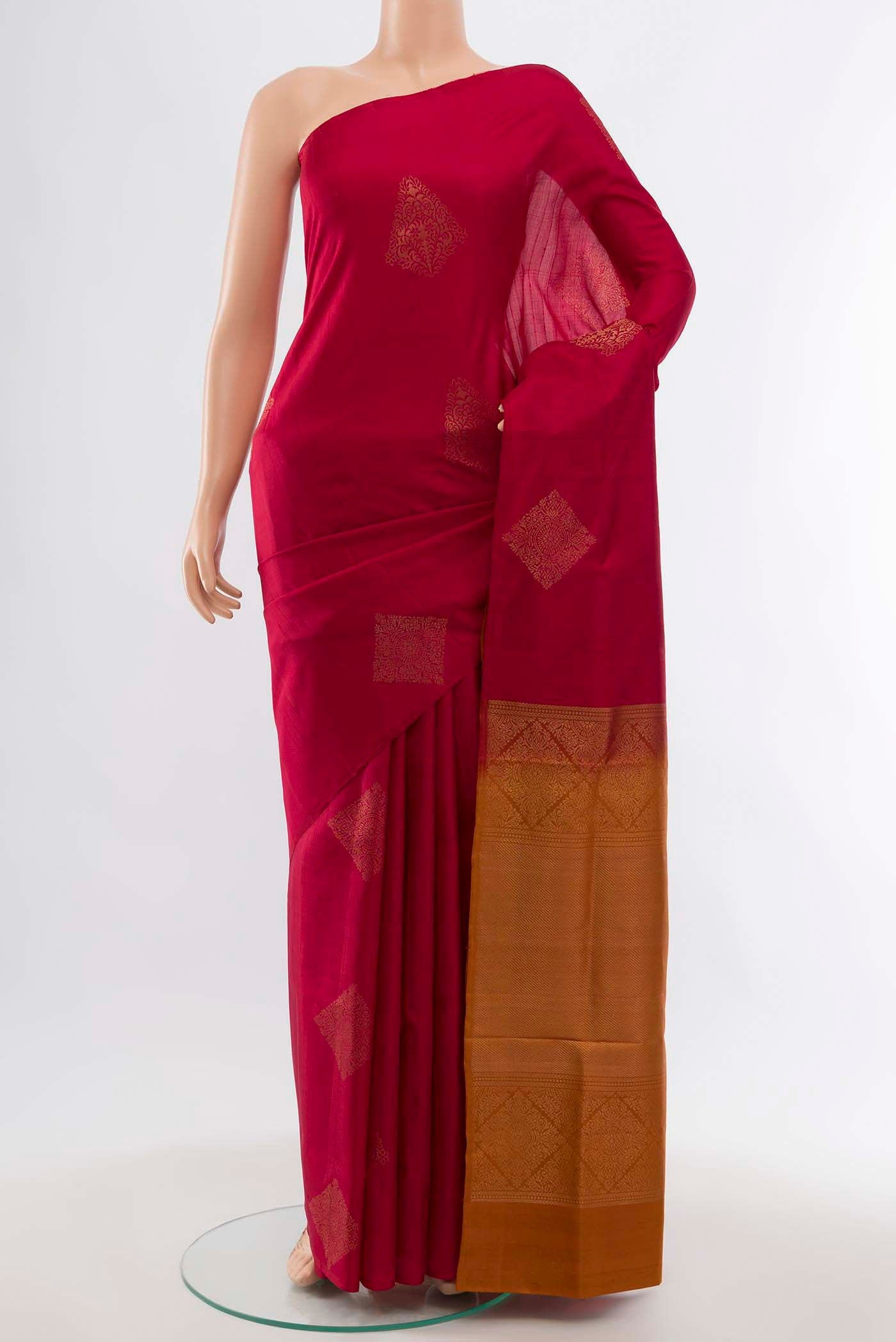 Maroon Soft Silk Saree with Zari Butta on the body and Silk Border displayed on a mannequin
