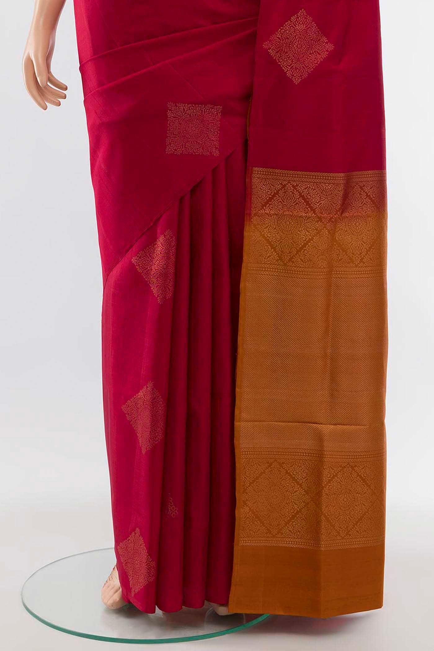 Pleats and pallu of Maroon Soft Silk Saree with Zari Butta on the body and Silk Border