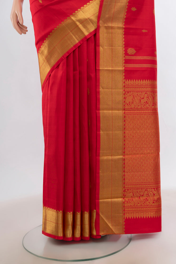 Pleats and pallu of Red Kanjivaram Silk Saree with Zari Butta on the body and Silk Border. 