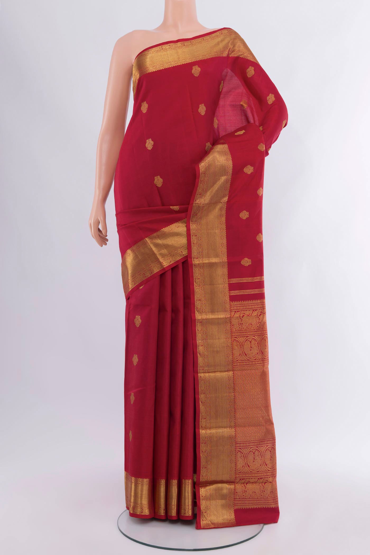 Pure Silk Pure Zari Red Kanjivaram Saree with Zari Butta on the body and Zari Border.  displayed on a mannequin