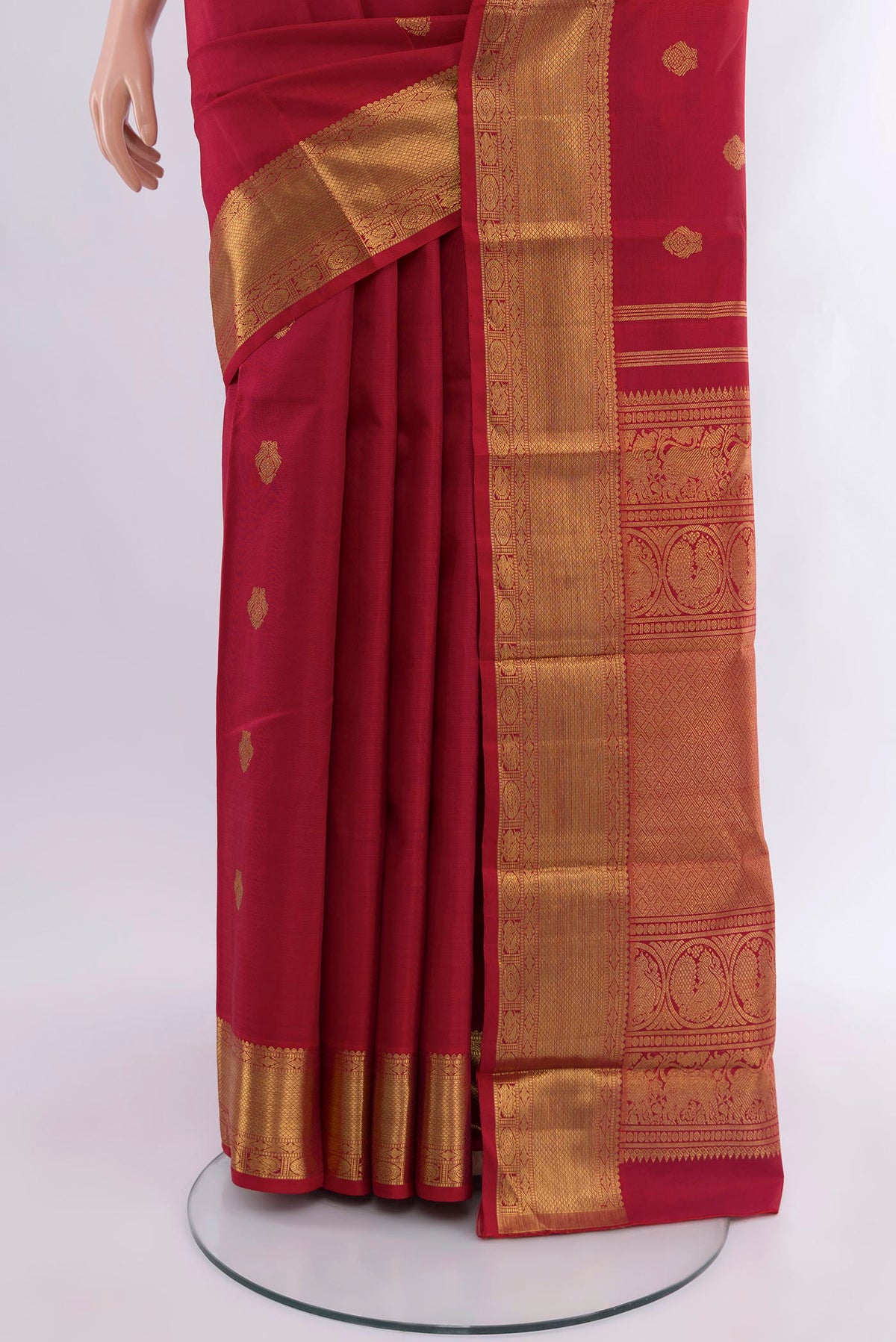 Pleats and pallu of Pure Silk Pure Zari Red Kanjivaram Saree with Zari Butta on the body and Zari Border. 