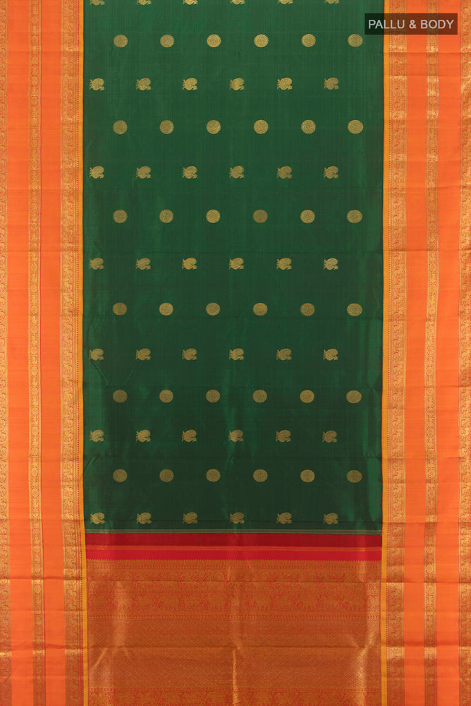 Flat view of Bottle Green Kanjivaram Silk Saree with Zari Butta on the body and Silk Border. 