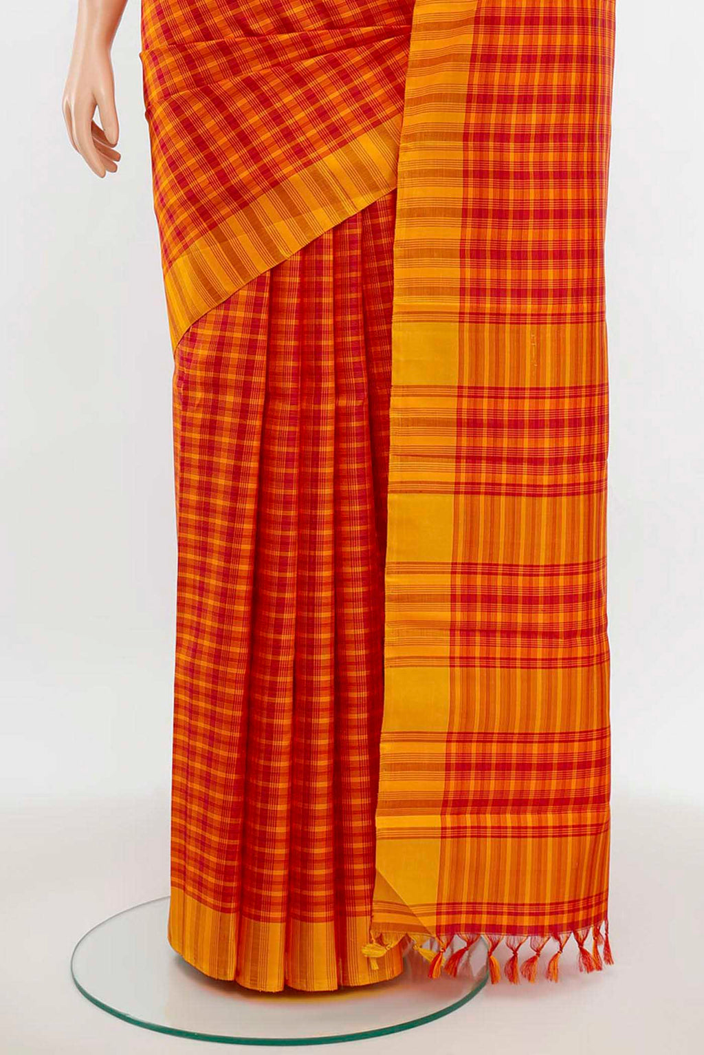 Pleats and pallu of Maroon Kanchipuram Silk Saree with Zari Butta on the body and Silk Border. 