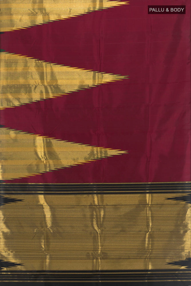 Flat view of Maroon Kanjivaram Silk Saree with Zari Butta on the body and Silk Border. 