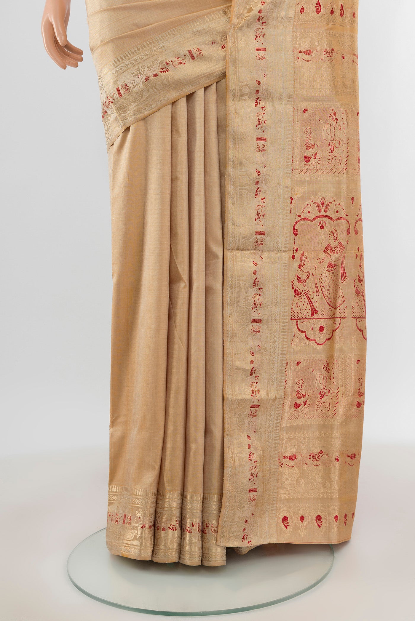 Pleats and pallu of Beige Baluchari Silk Saree with Zari And Thread Butta on the body and Zari Border. 