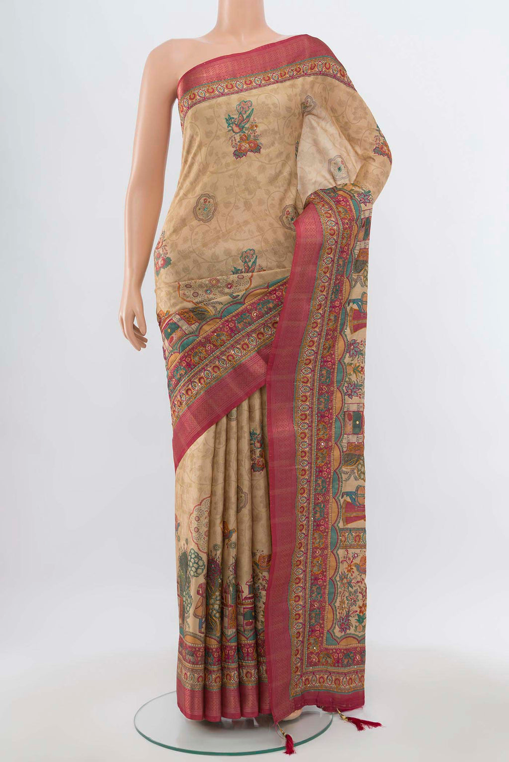 Beige Art Silk Saree with Zari Butta on the body and Zari Border.  displayed on a mannequin