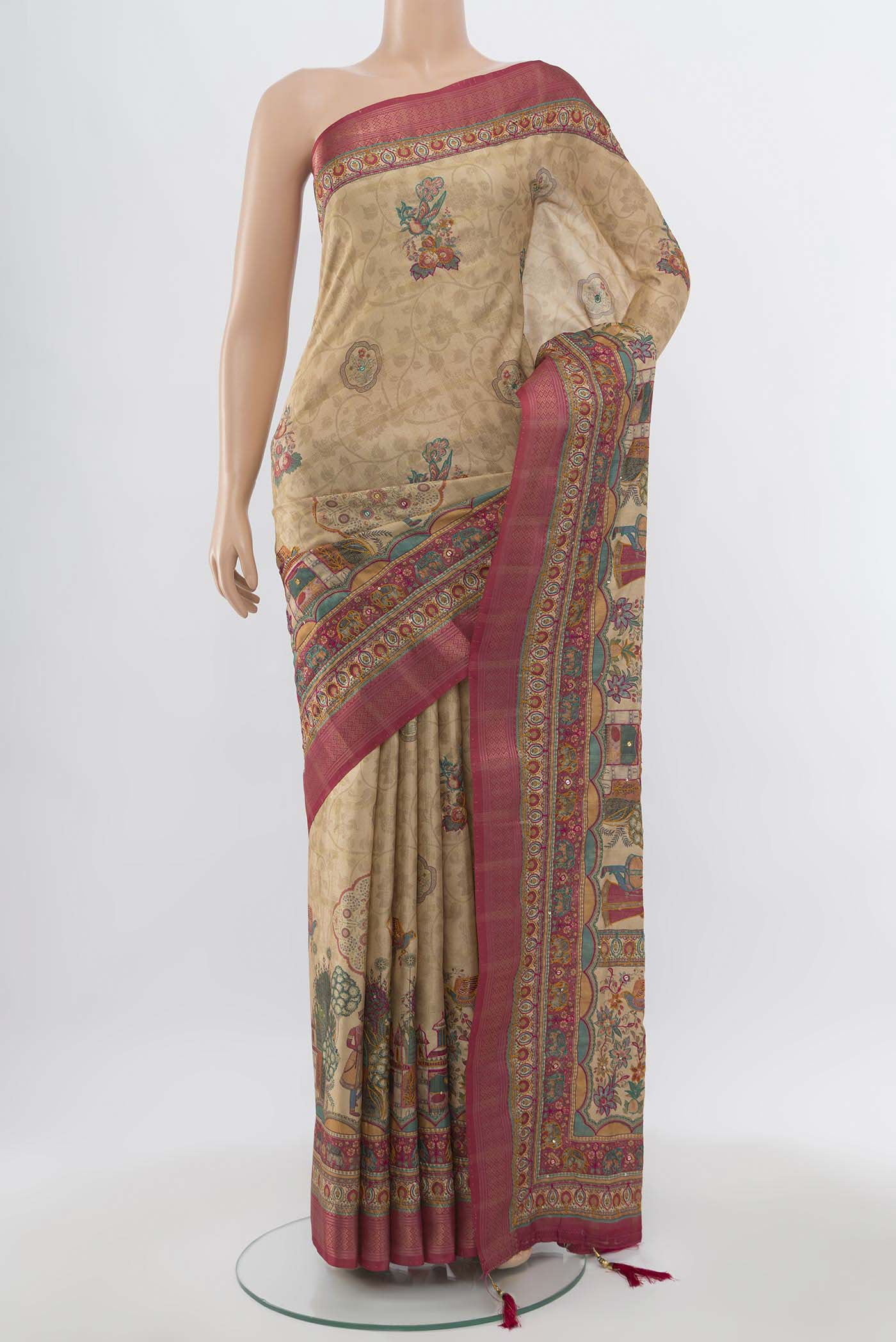 Beige Art Silk Saree with Zari Butta on the body and Zari Border.  displayed on a mannequin