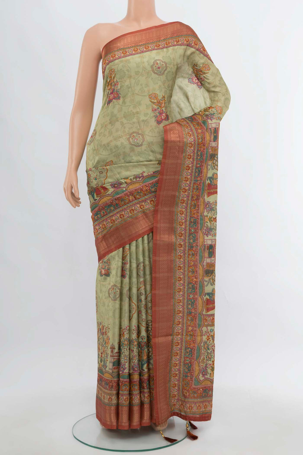 Pista Green Art Silk Saree with Embroidery on the body and Silk Border.  displayed on a mannequin