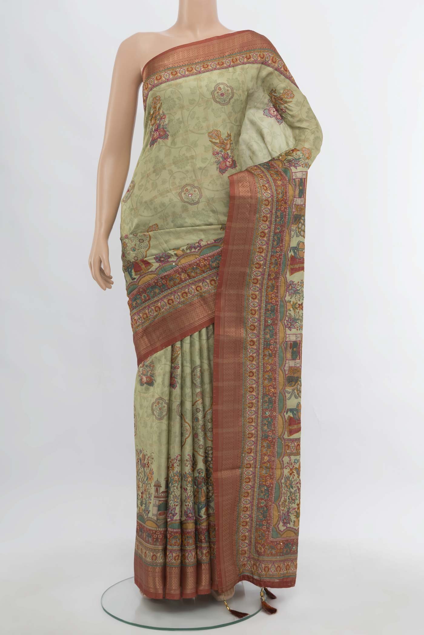 Pista Green Art Silk Saree with Embroidery on the body and Silk Border.  displayed on a mannequin