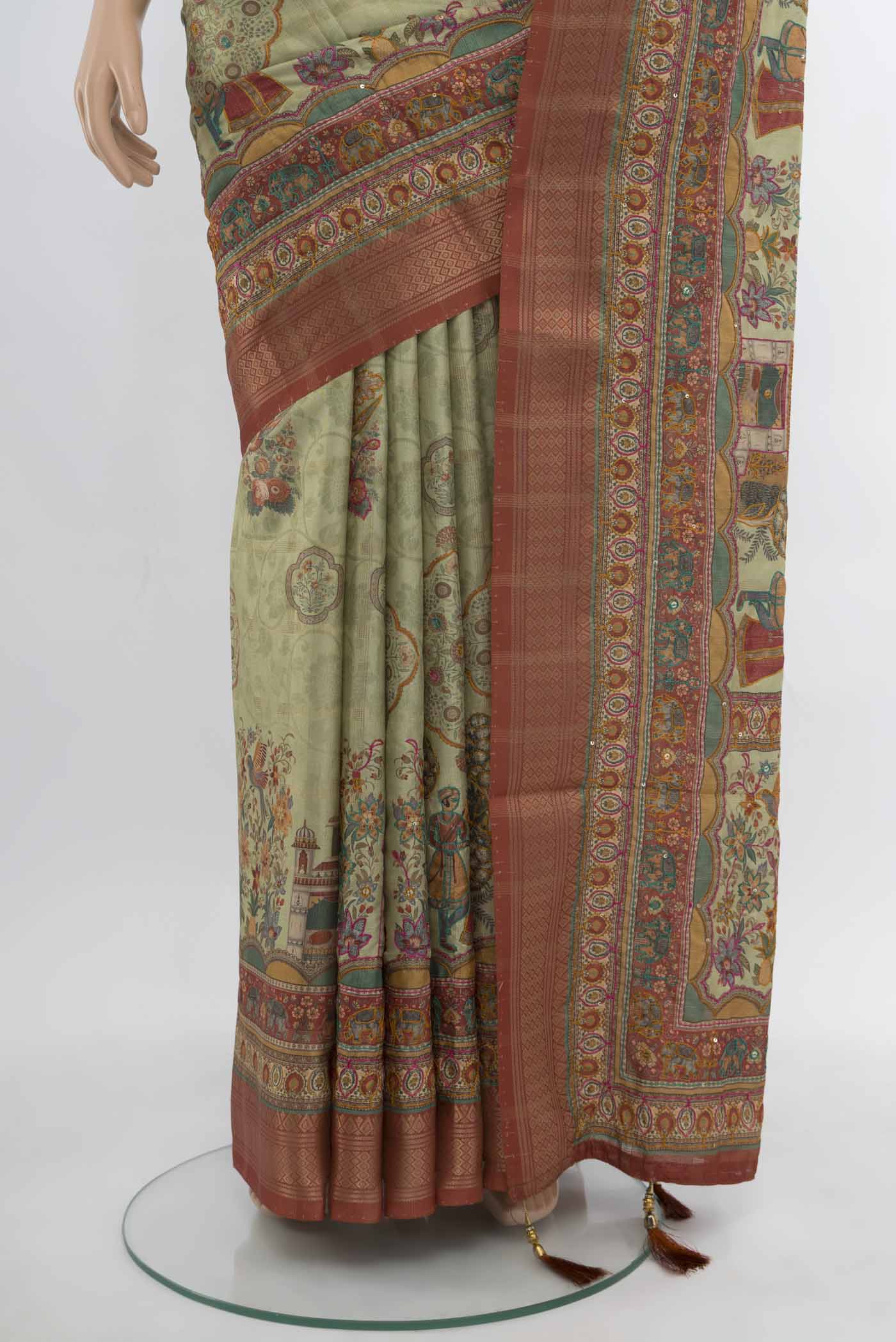 Pleats and pallu of Pista Green Art Silk Saree with Embroidery on the body and Silk Border. 
