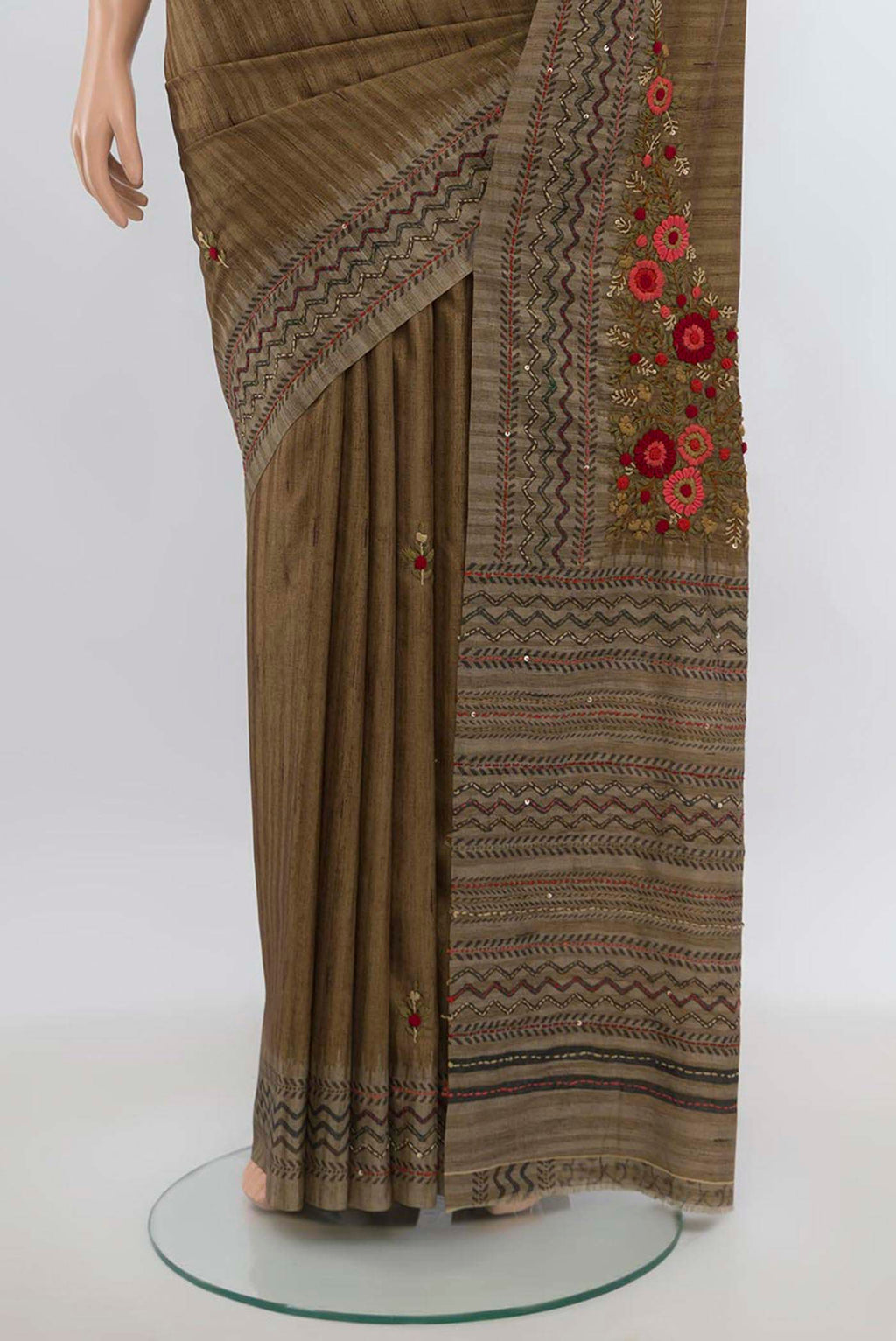 Pleats and pallu of Brown Art Silk Saree with Zari Butta on the body and Zari Border. 