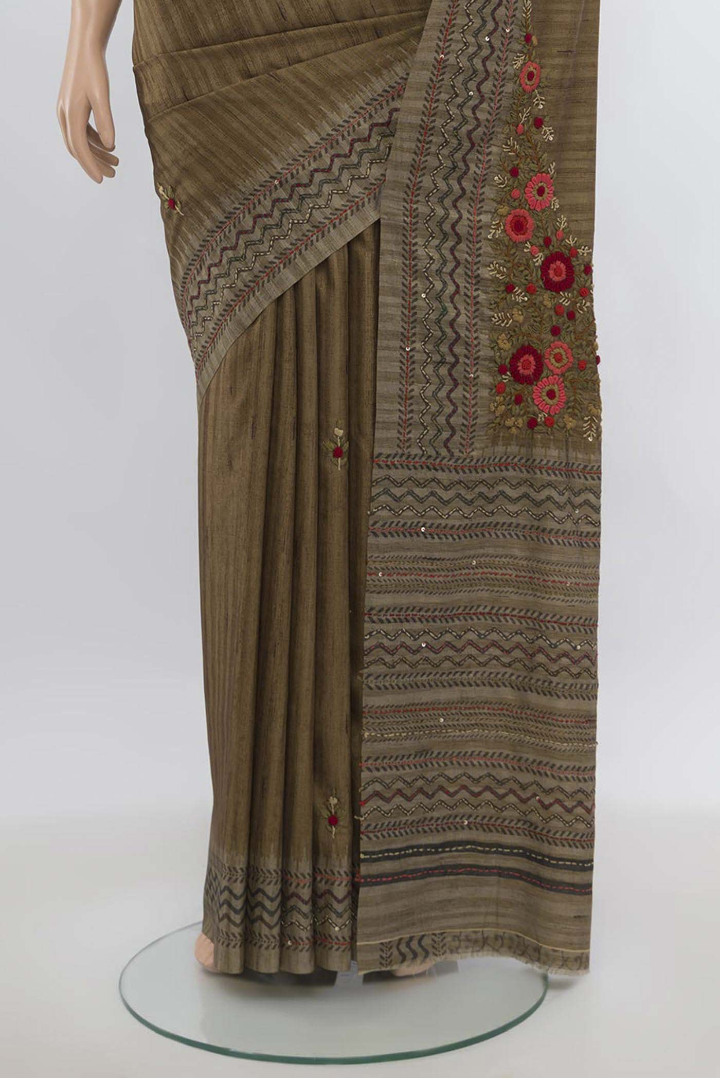 Pleats and pallu of Brown Art Silk Saree with Zari Butta on the body and Zari Border. 