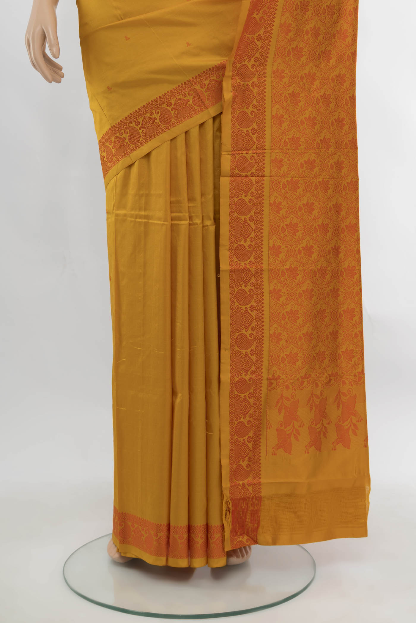 Pleats and pallu of Yellow Kanjivaram Silk Saree with Zari Butta on the body and Silk Border. 