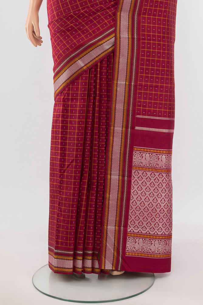 Pleats and pallu of Maroon Kanjivaram Silk Saree with Zari Butta on the body and Silk Border. 