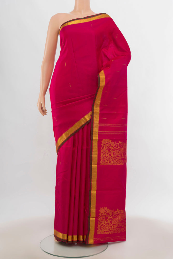 Dark Pink Pochampally Saree with Zari Butta on the body and Silk Border.  displayed on a mannequin