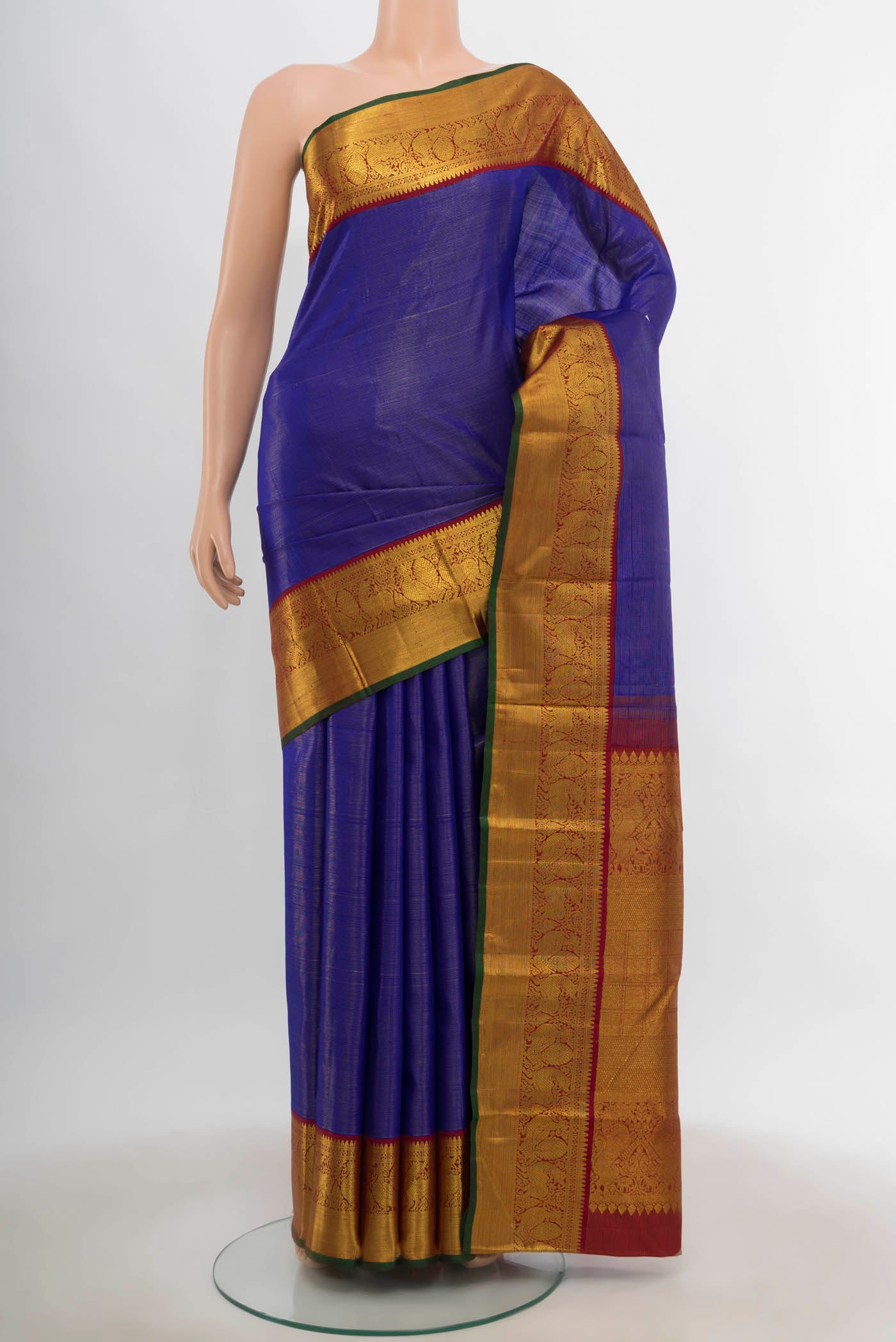 Dark Blue Kanchipuram Silk Saree with Zari Butta on the body and Silk Border.  displayed on a mannequin