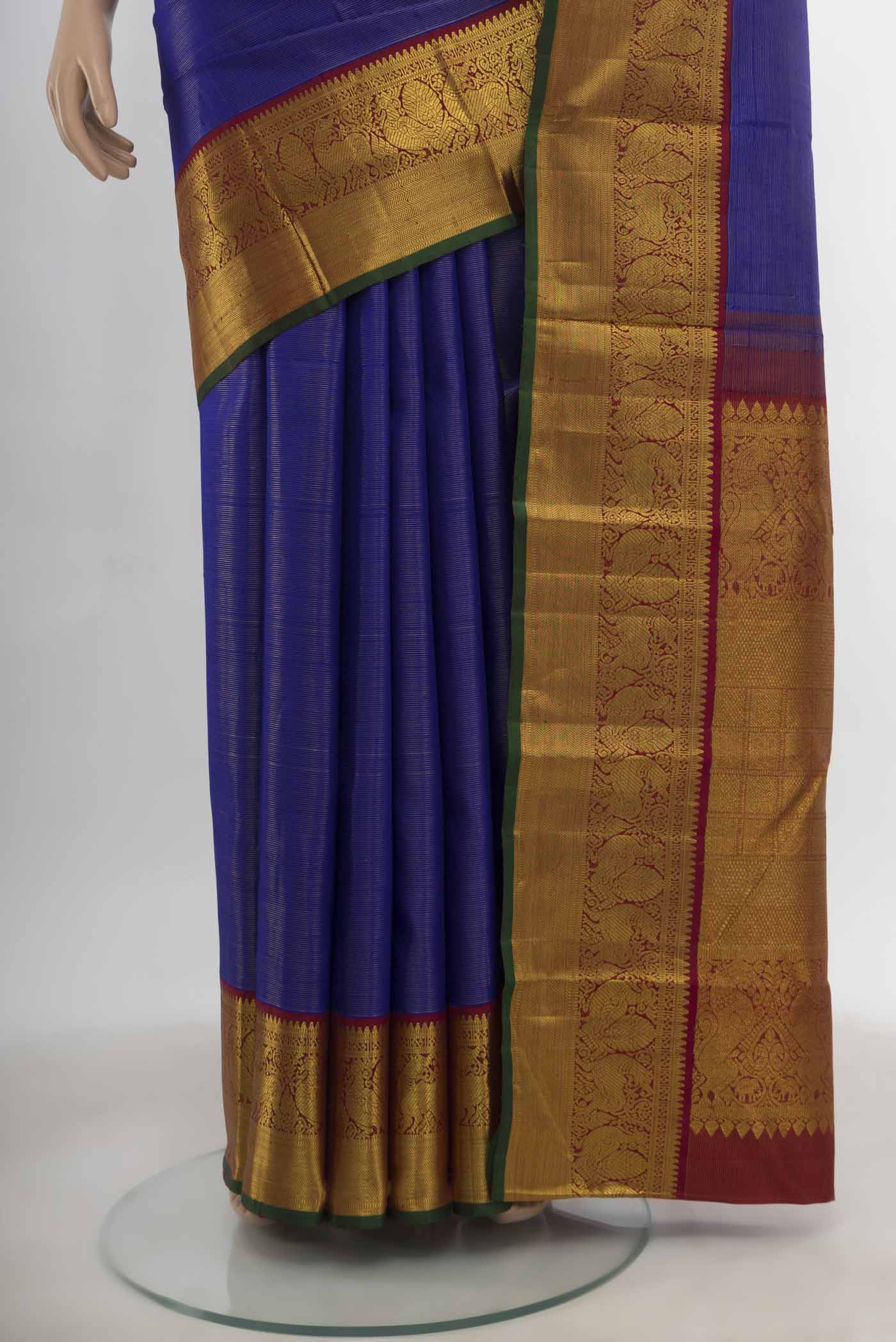 Pleats and pallu of Dark Blue Kanchipuram Silk Saree with Zari Butta on the body and Silk Border. 