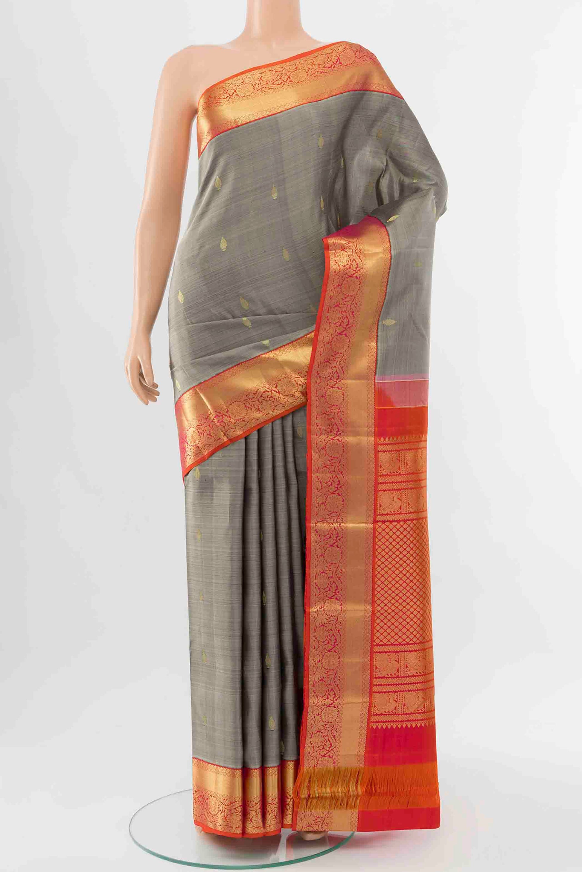 Grey Kanchipuram Silk Saree with Zari Butta on the body and Zari Border displayed on a mannequin