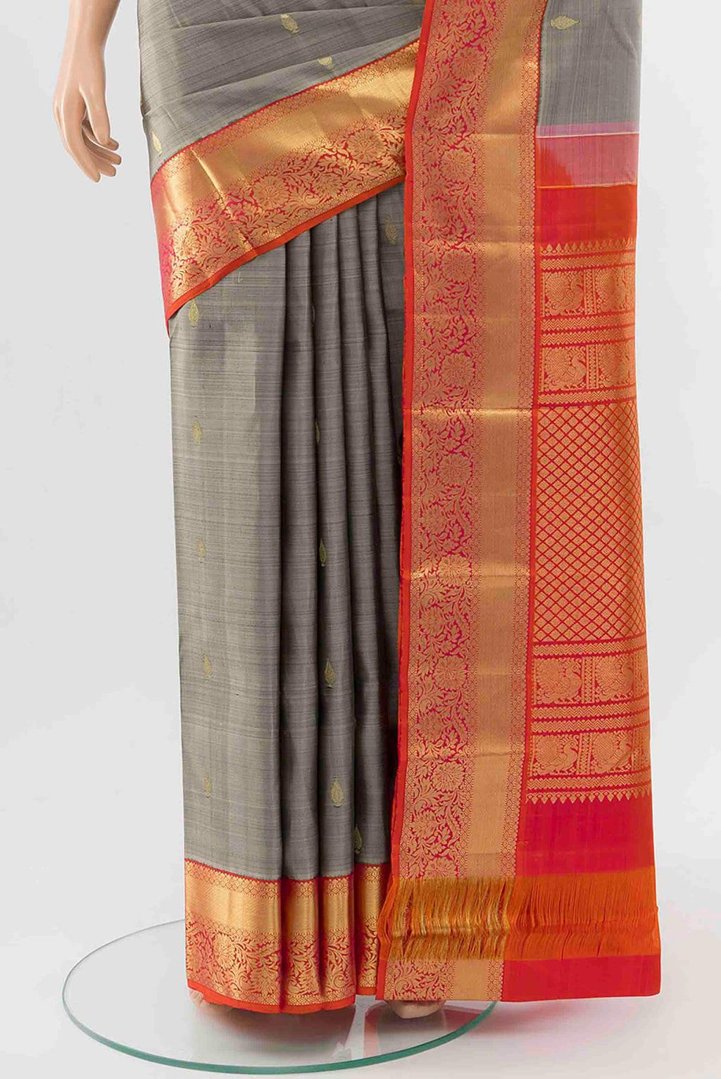 Pleats and pallu of Grey Kanchipuram Silk Saree with Zari Butta on the body and Zari Border