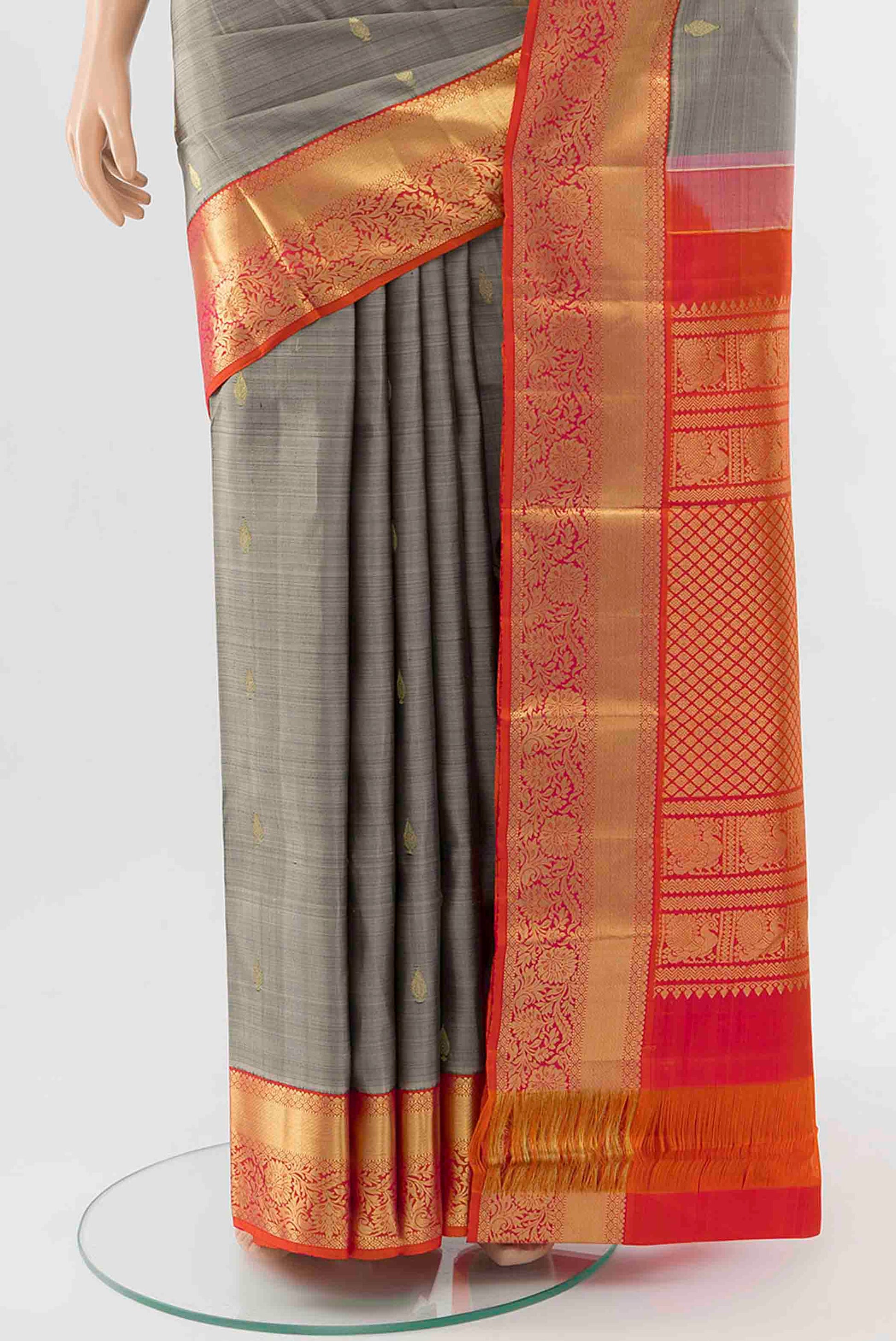 Pleats and pallu of Grey Kanchipuram Silk Saree with Zari Butta on the body and Zari Border