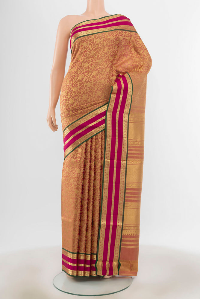 Golden Kanchipuram Silk Saree with Zari Butta on the body and Silk Border.  displayed on a mannequin