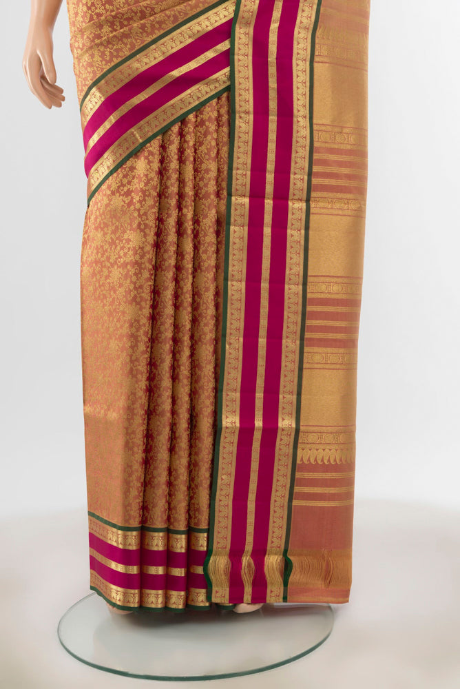 Pleats and pallu of Golden Kanchipuram Silk Saree with Zari Butta on the body and Silk Border. 