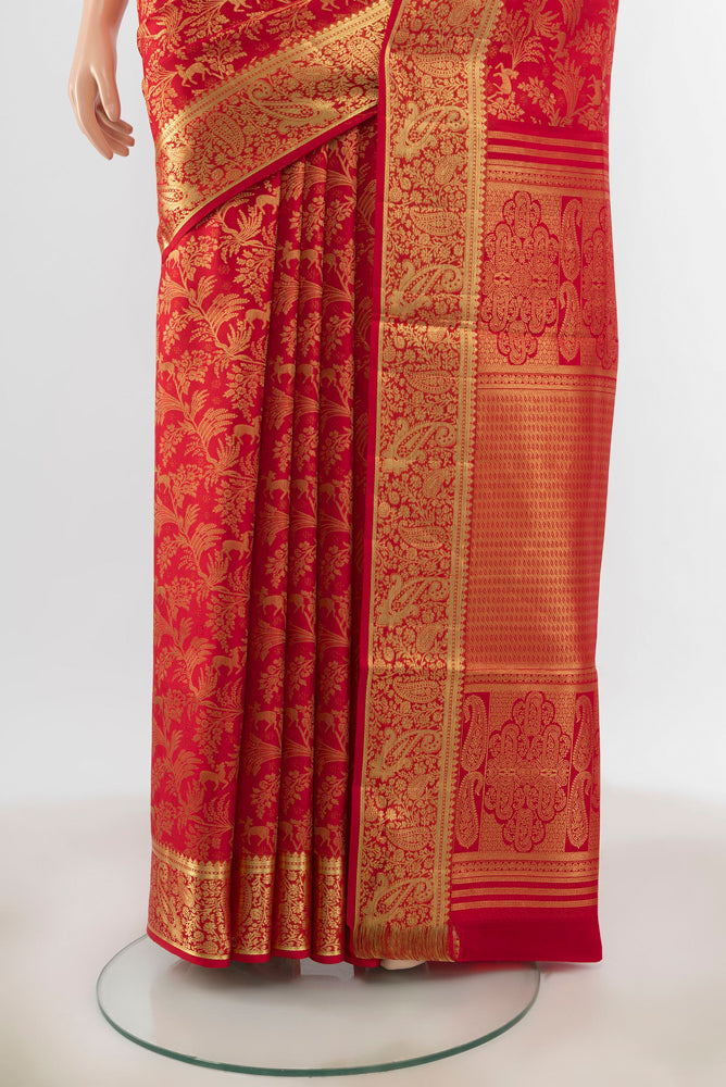 Pleats and pallu of Red Kanchipuram Silk Saree with Zari Butta on the body and Silk Border. 