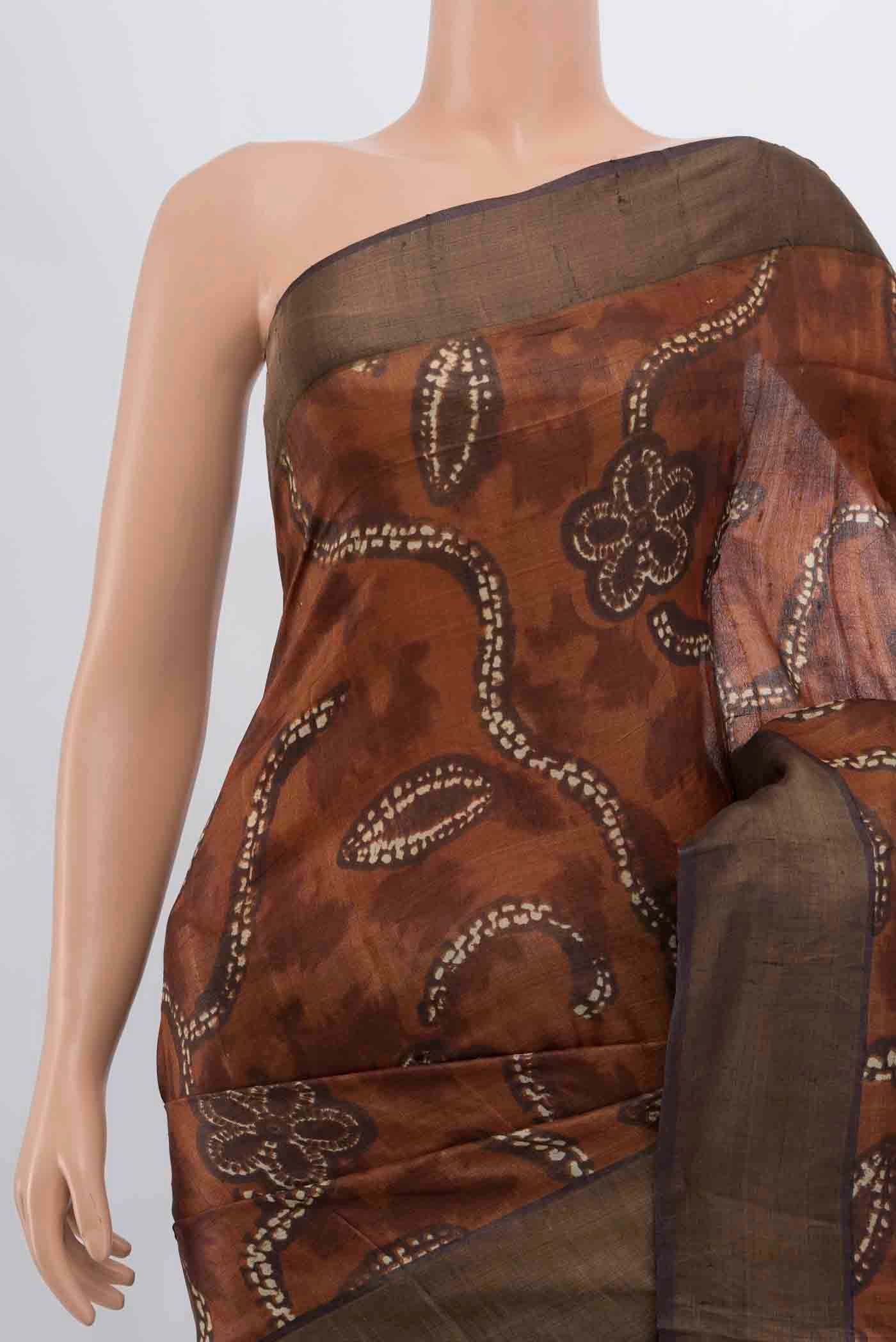 Border image of Brown Tussar Silk Saree with Zari Butta on the body and Silk Border