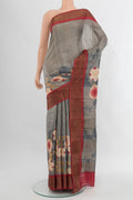 Grey Tussar Silk Saree with Floral Print on the body and Zari Border.  displayed on a mannequin