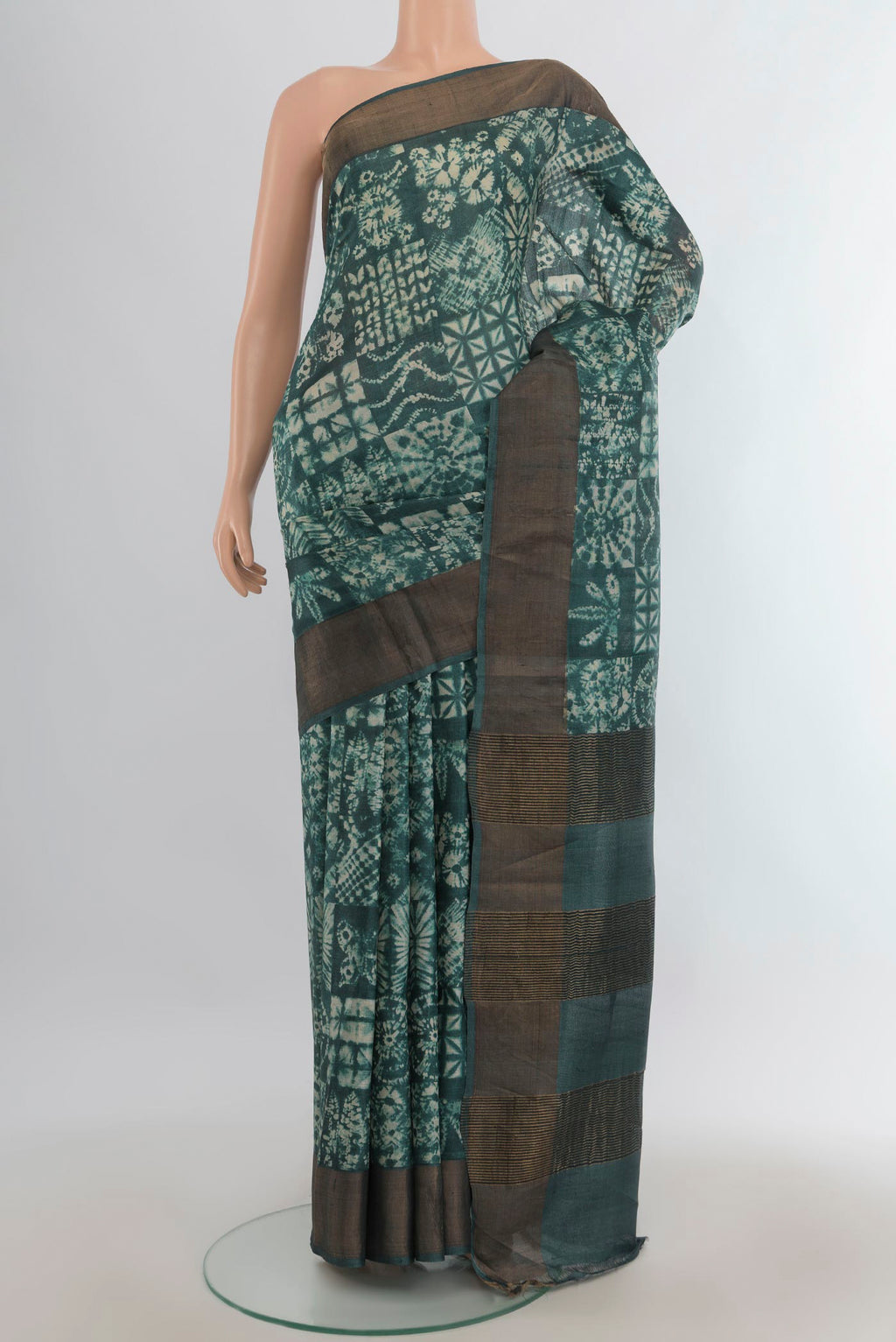 Multi Color Tussar Saree with Floral Print on the body and Silk Border.  displayed on a mannequin