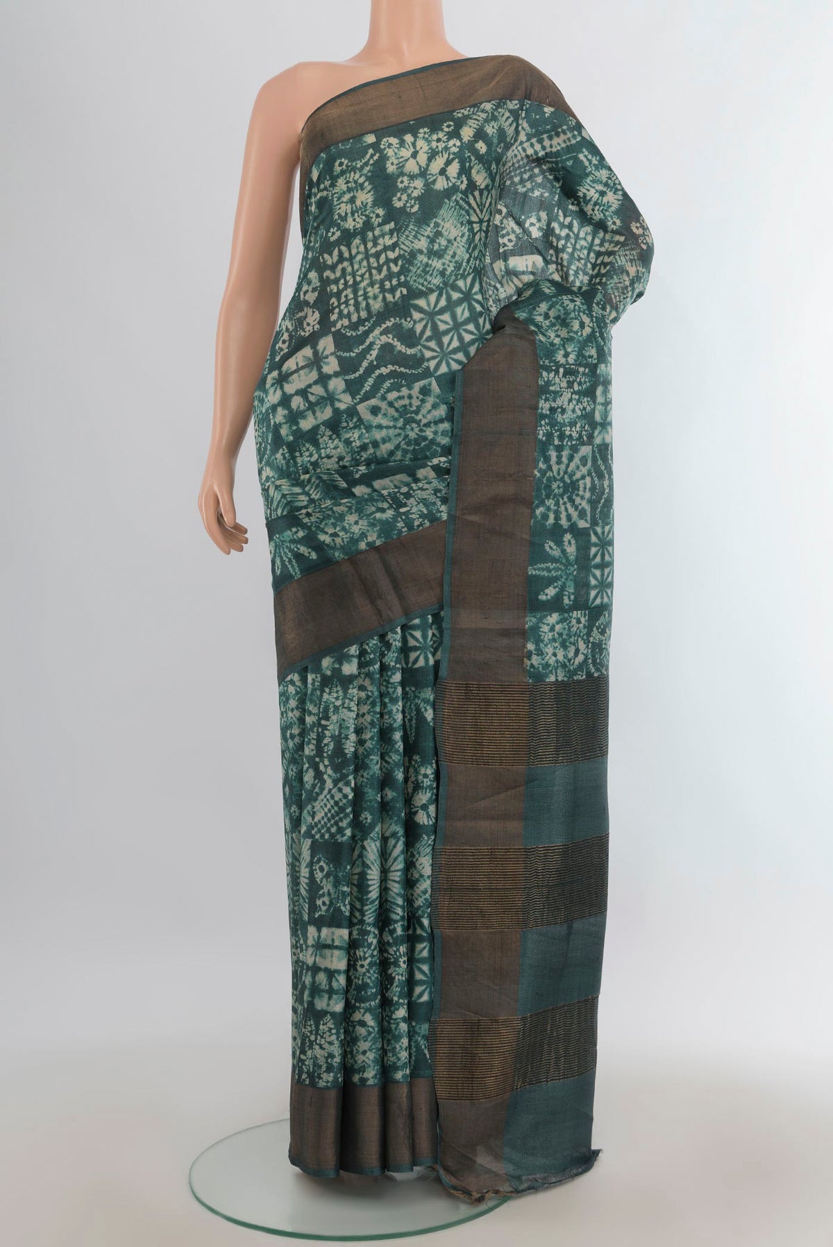 Multi Color Tussar Saree with Floral Print on the body and Silk Border.  displayed on a mannequin