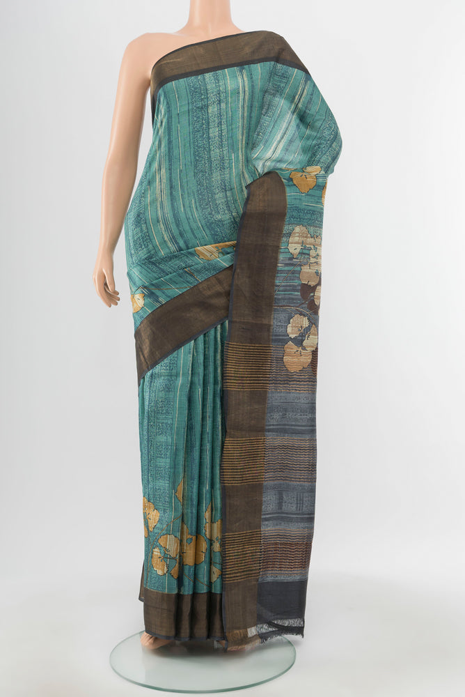 Pure Silk Pure Zari Multi Color Tussar Saree with Floral Print on the body and Silk Border.  displayed on a mannequin