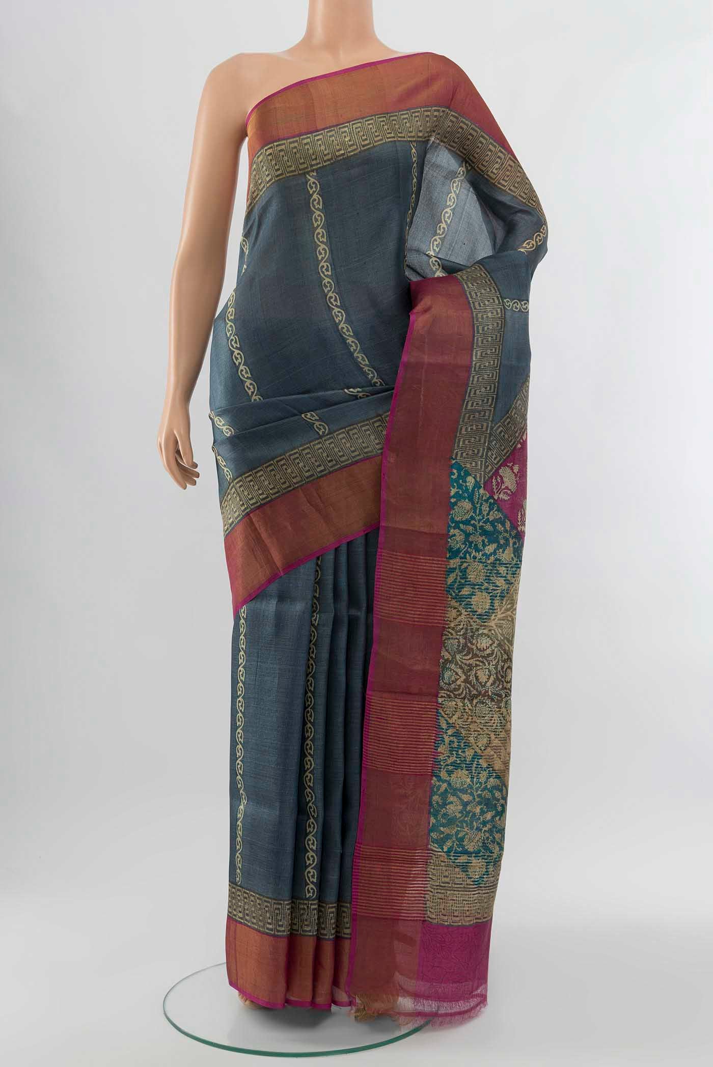 Grey Tussar Silk Saree with Floral Print on the body and Silk Border displayed on a mannequin