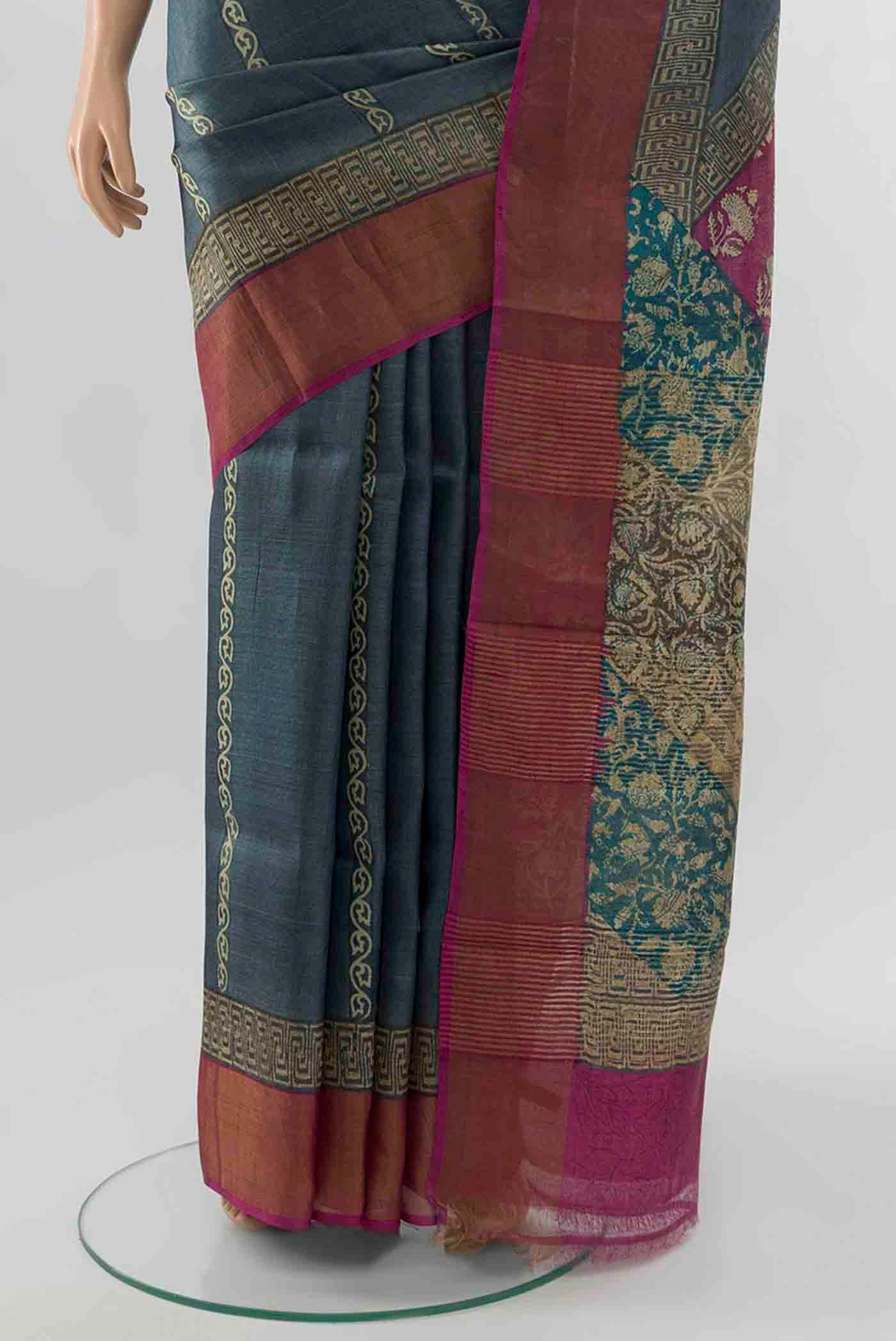Pleats and pallu of Grey Tussar Silk Saree with Floral Print on the body and Silk Border