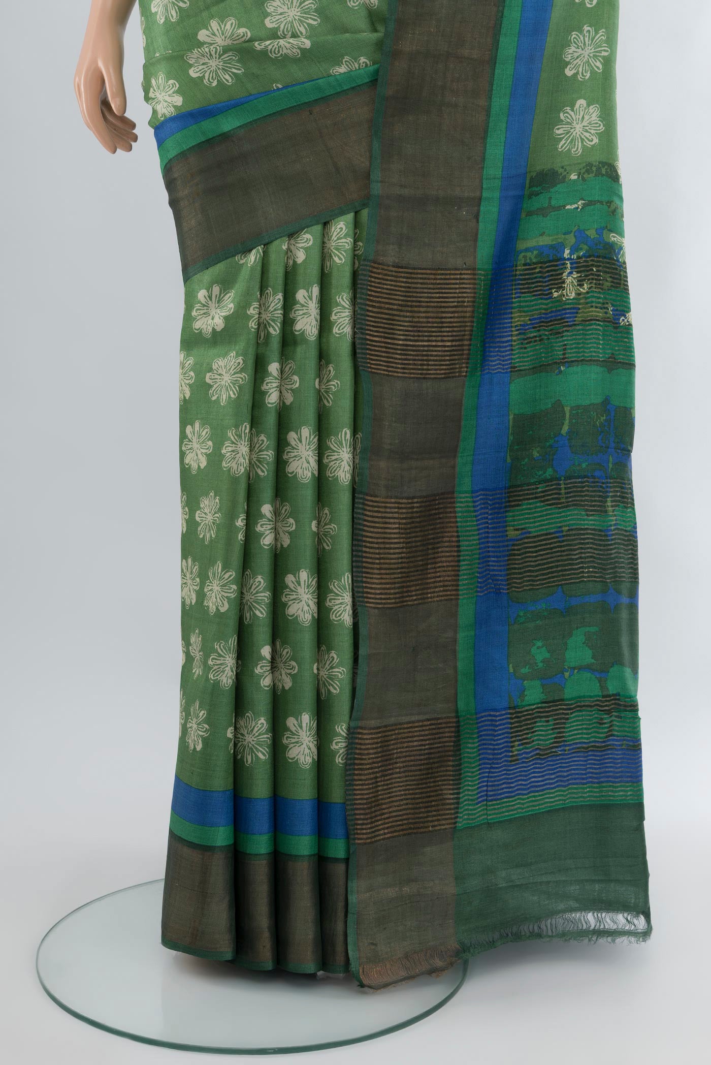 Pleats and pallu of Pista Green Tussar Silk Saree with Floral Print on the body and Zari Border. 