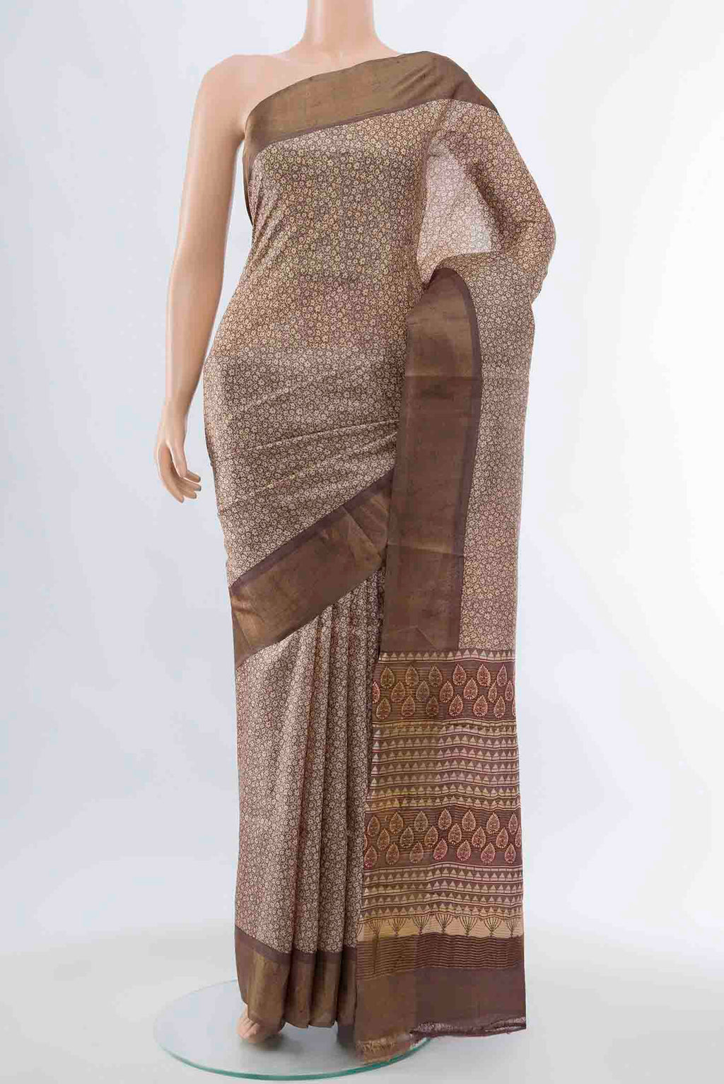 Beige Tussar Silk Saree with Zari Brocade on the body and Silk Border displayed on a mannequin