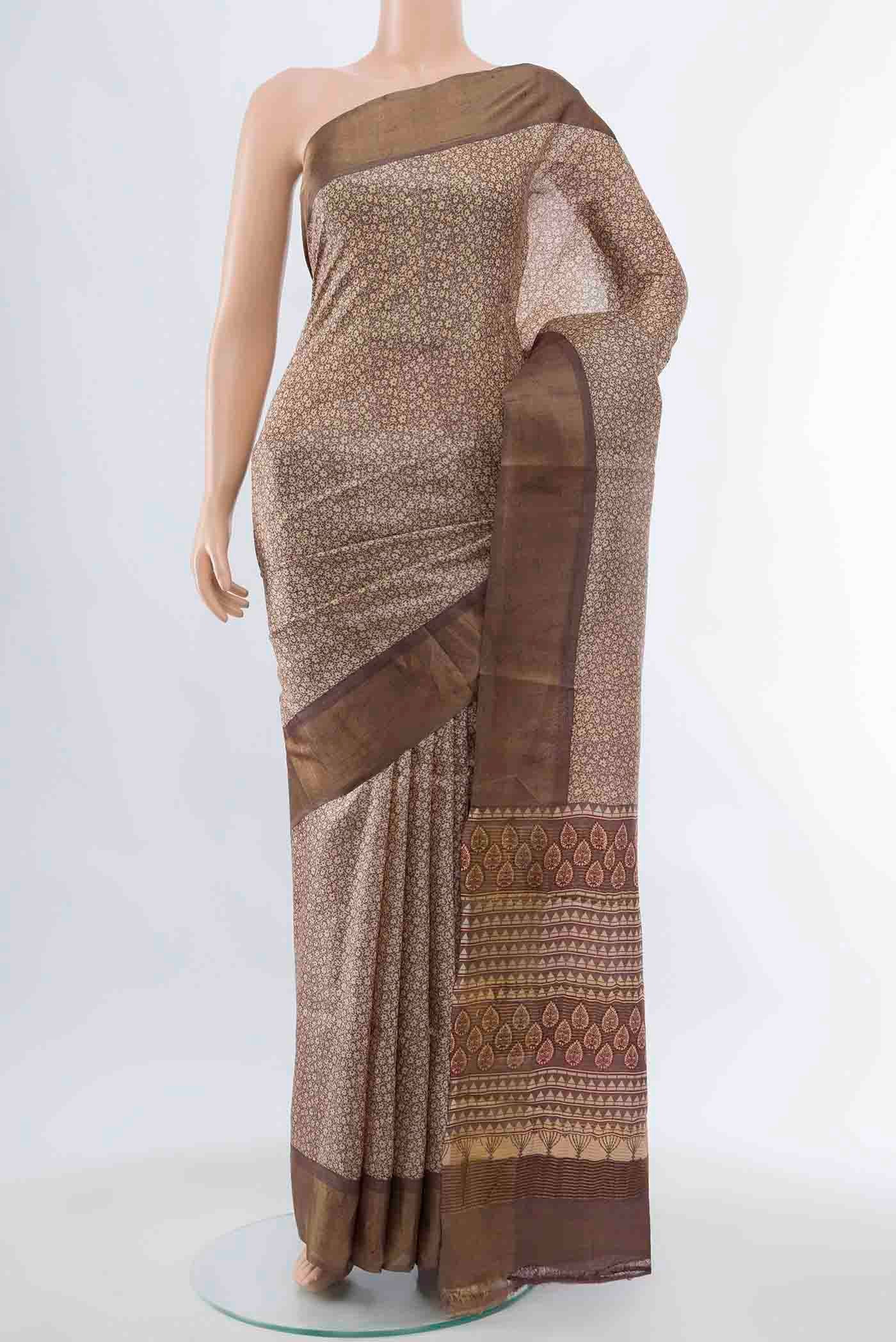 Beige Tussar Silk Saree with Zari Brocade on the body and Silk Border displayed on a mannequin