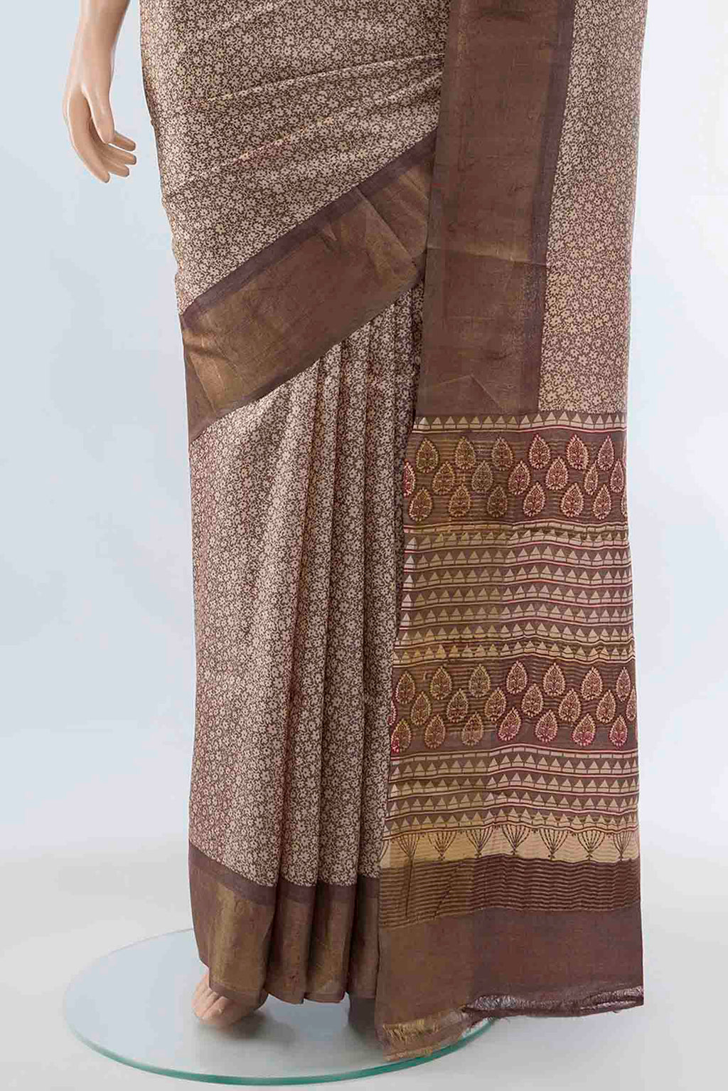 Pleats and pallu of Beige Tussar Silk Saree with Zari Brocade on the body and Silk Border