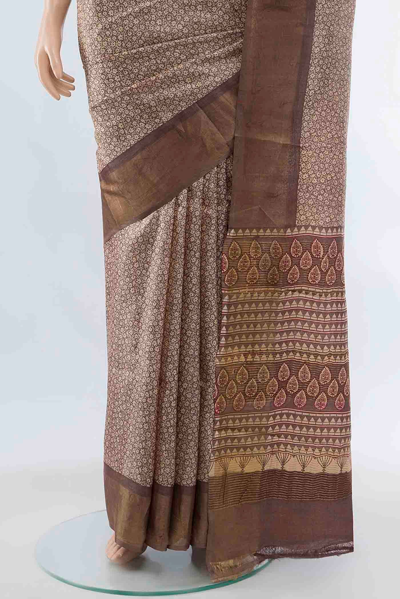 Pleats and pallu of Beige Tussar Silk Saree with Zari Brocade on the body and Silk Border