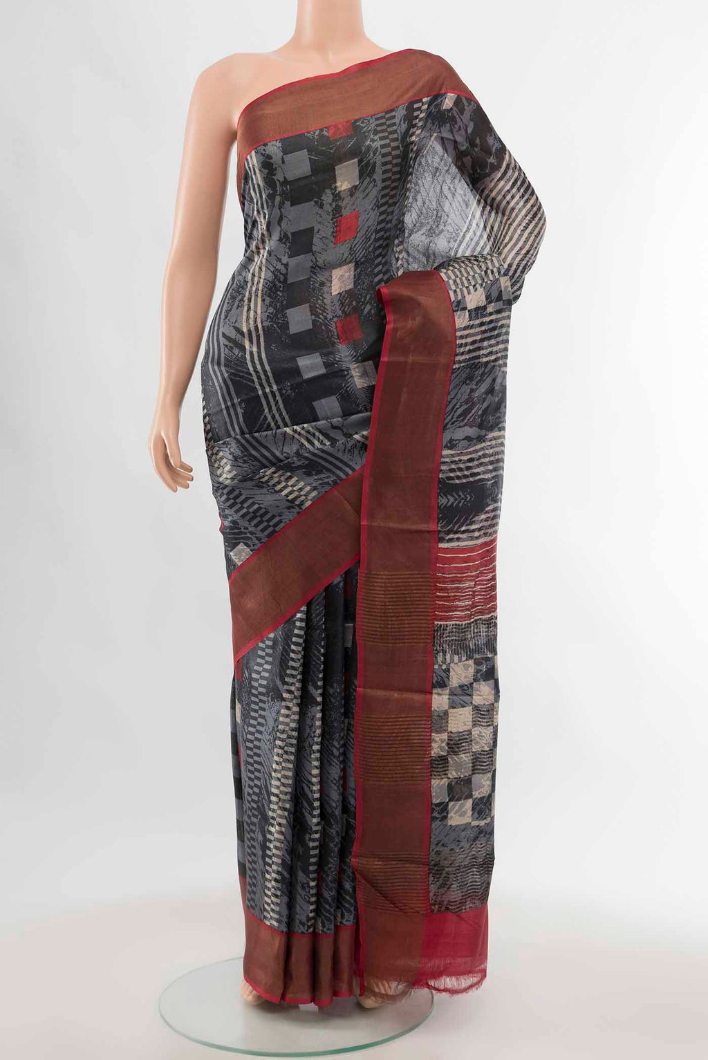 Pure Silk Pure Zari Grey Tussar Saree with Zari Brocade on the body and Silk Border displayed on a mannequin