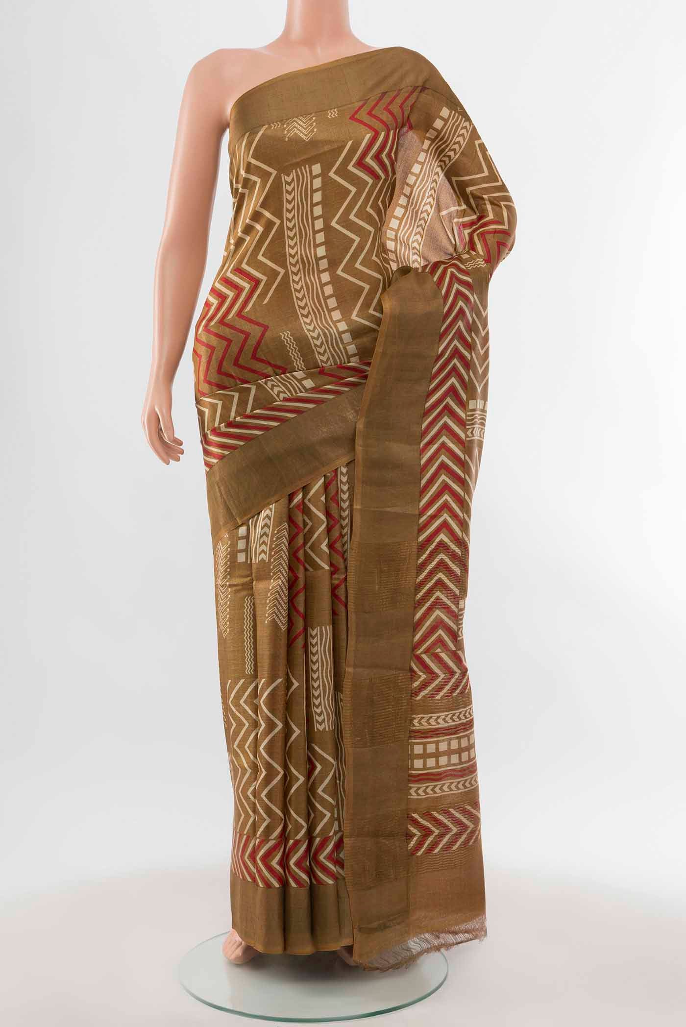 Mehandi Green Tussar Silk Saree with Zari Brocade on the body and Silk Border displayed on a mannequin
